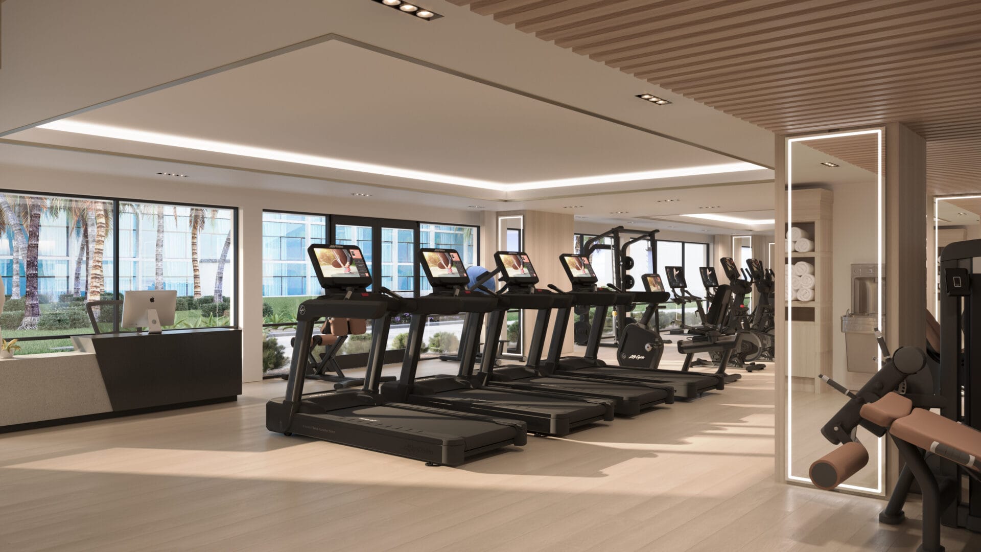 A gym with many treadmills and other equipment.